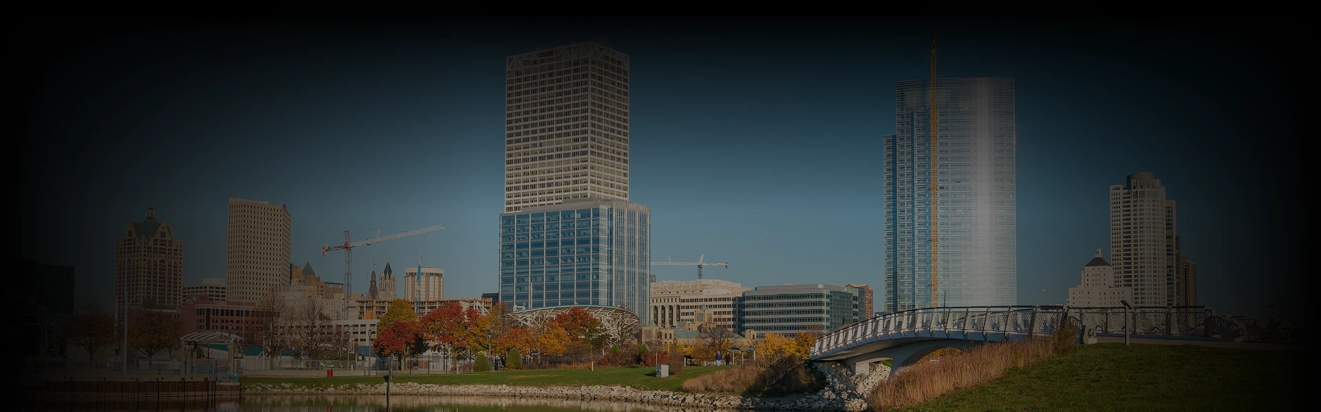 Downtown Milwaukee skyline with a luxury car booking panel overlay, promoting Prestige Ride's city-to-city chauffeur service from Chicago to Milwaukee.